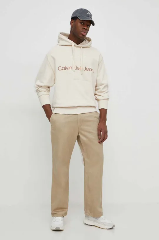 Bombažen pulover Calvin Klein Jeans bež