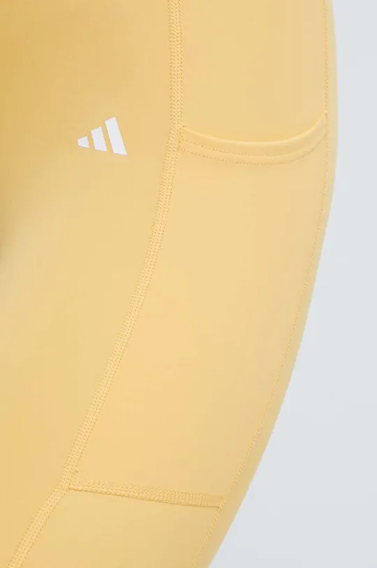 żółty adidas Performance legginsy treningowe Optime