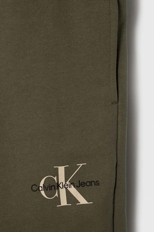Dječji pamučni donji dio trenirke Calvin Klein Jeans Temeljni materijal: 100% Pamuk Manžeta: 97% Pamuk, 3% Elastan