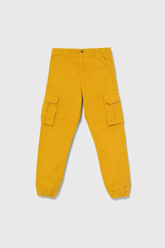жовтий Дитячі бавовняні штани Guess Для хлопчиків