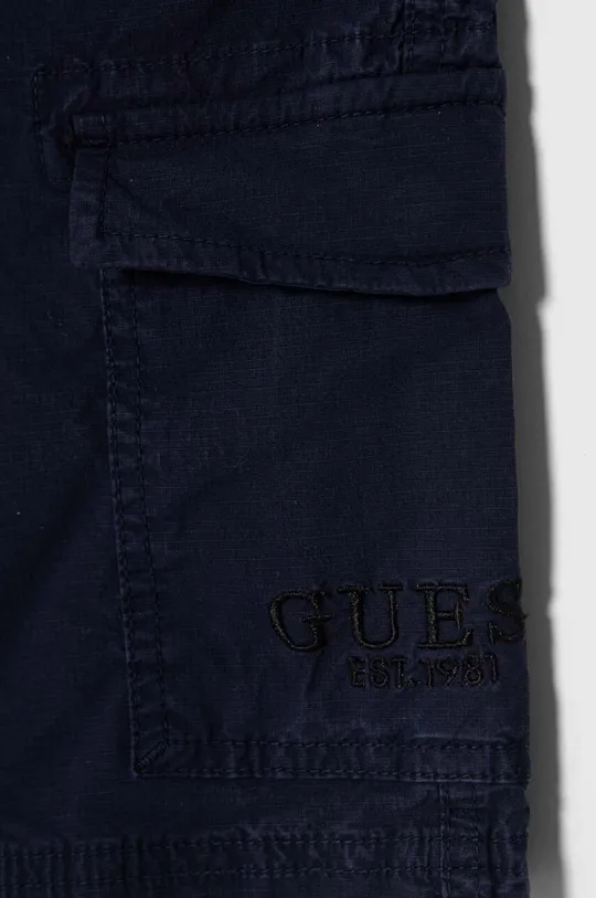 Παιδικό παντελόνι Guess Κύριο υλικό: 98% Βαμβάκι, 2% Σπαντέξ Φόδρα τσέπης: 100% Βαμβάκι
