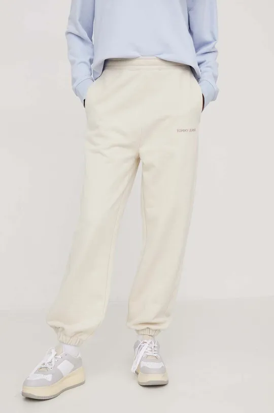 Tommy Jeans spodnie dresowe bawełniane beżowy