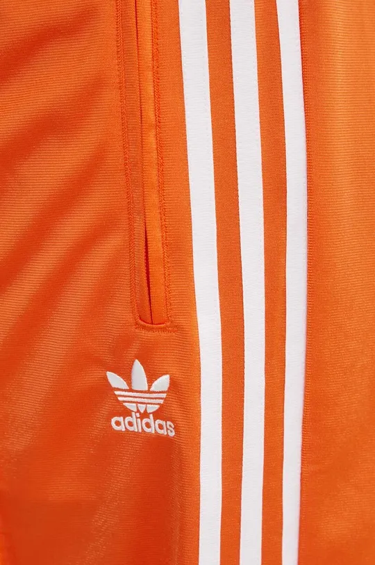 pomarańczowy adidas Originals spodnie dresowe