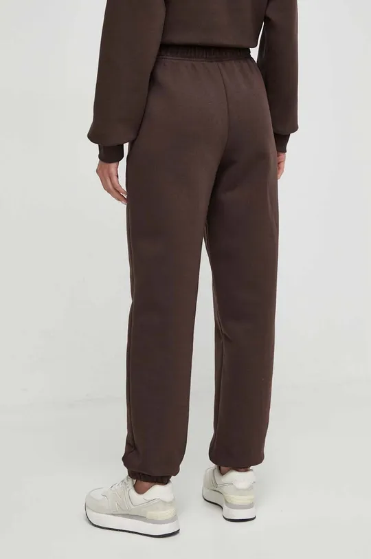 New Balance spodnie dresowe WP33513KCF 60 % Bawełna, 40 % Poliester z recyklingu