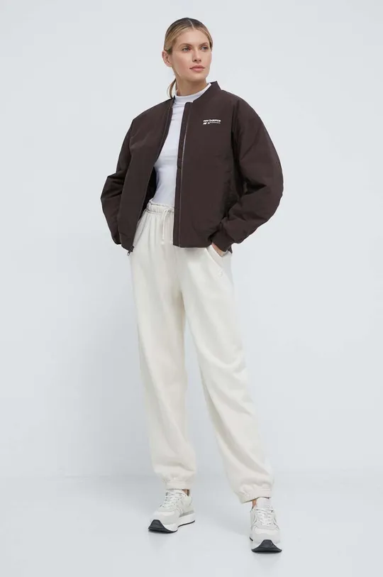 New Balance spodnie dresowe bawełniane WP41513LIN beżowy