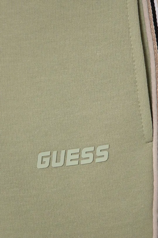 Detské tepláky Guess 51 % Bavlna, 49 % Polyester