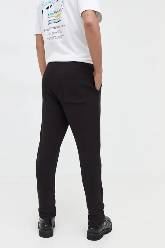 Tommy Jeans spodnie dresowe bawełniane Materiał zasadniczy: 100 % Bawełna Podszewka kieszeni: 95 % Bawełna, 5 % Elastan 