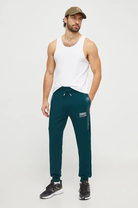 Guess spodnie dresowe GASTON zielony