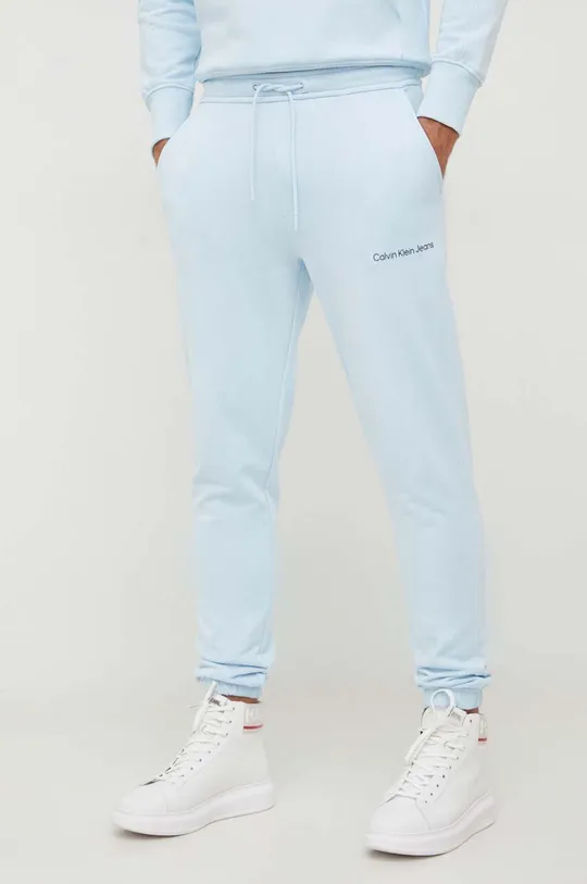 modra Bombažen spodnji del trenirke Calvin Klein Jeans Moški