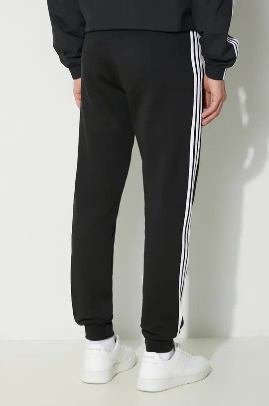 adidas Originals joggers 3-Stripes Pant Main: 70% Cotton, 30% Recycled polyester Insert: 100% Cotton Rib-knit waistband: 95% Cotton, 5% Elastane