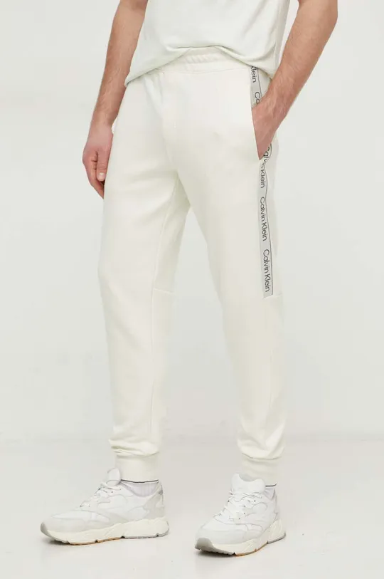 beżowy Calvin Klein spodnie dresowe Męski
