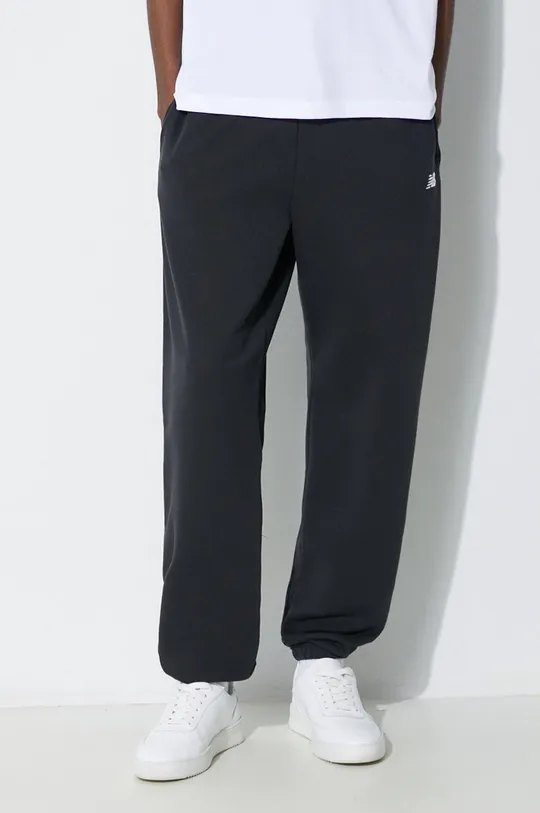 czarny New Balance spodnie dresowe Essentials French Terry Jogger