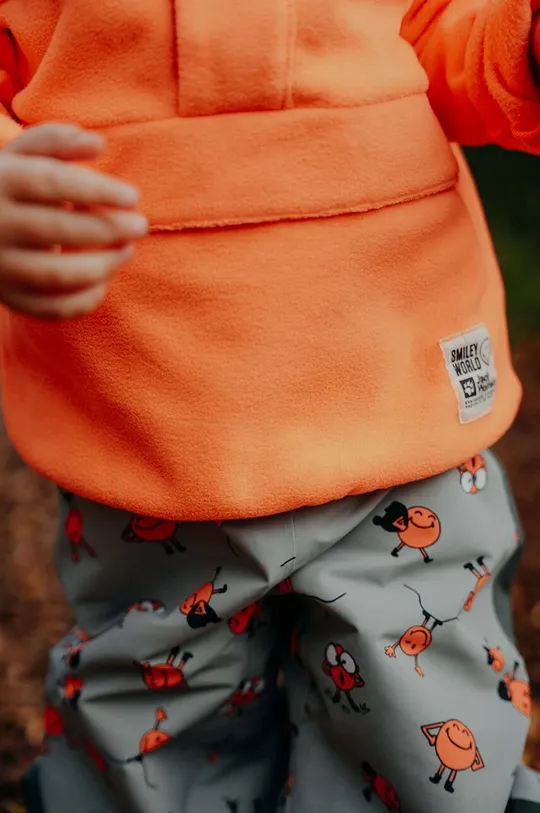 oranžna Otroški pulover Jack Wolfskin SMILEYWORLD MIDLAYER