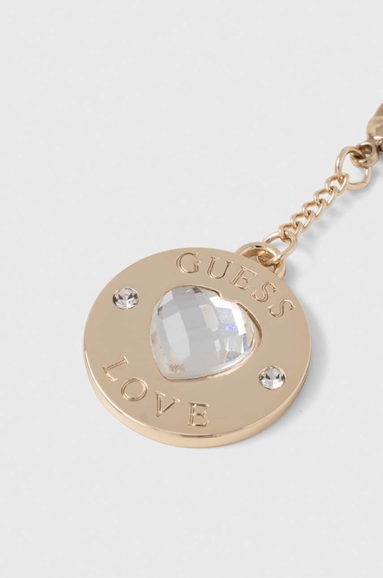 Privjesak za telefon Guess GUCPMHGLD zlatna AA00