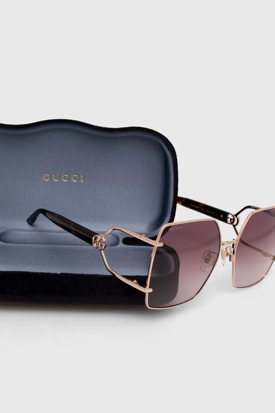 Солнцезащитные очки Gucci золотой GG1564SA