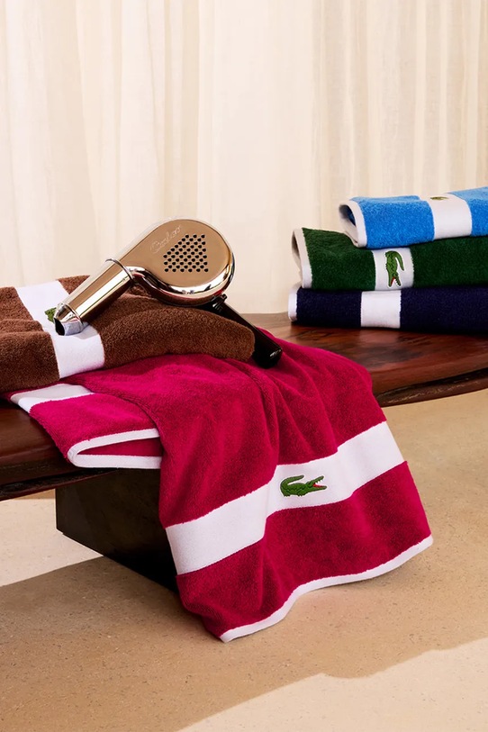 Μεσαία βαμβακερή πετσέτα Lacoste LCASUAL Bigarreau 70 x 140 cm 1063378 μωβ