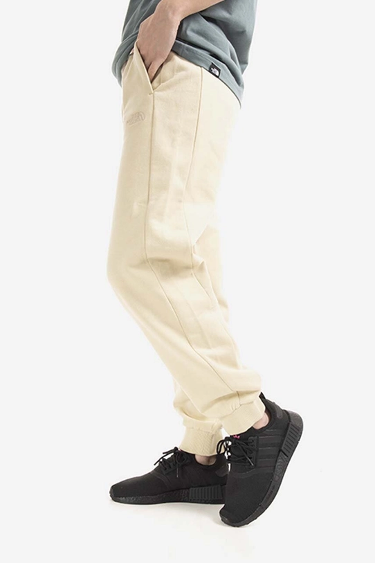 The North Face spodnie dresowe bawełniane Oversized Jogger NF0A5IGE beżowy