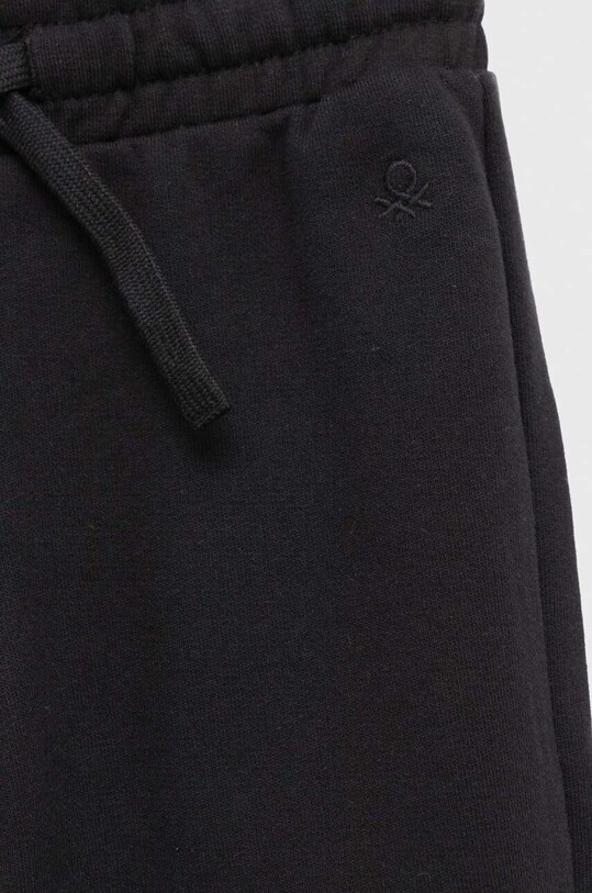 Chłopiec United Colors of Benetton spodnie dresowe bawełniane dziecięce 3J68CF02H.G.NOS czarny