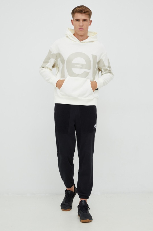 New Balance bluza bawełniana UT23504SST beżowy AW22