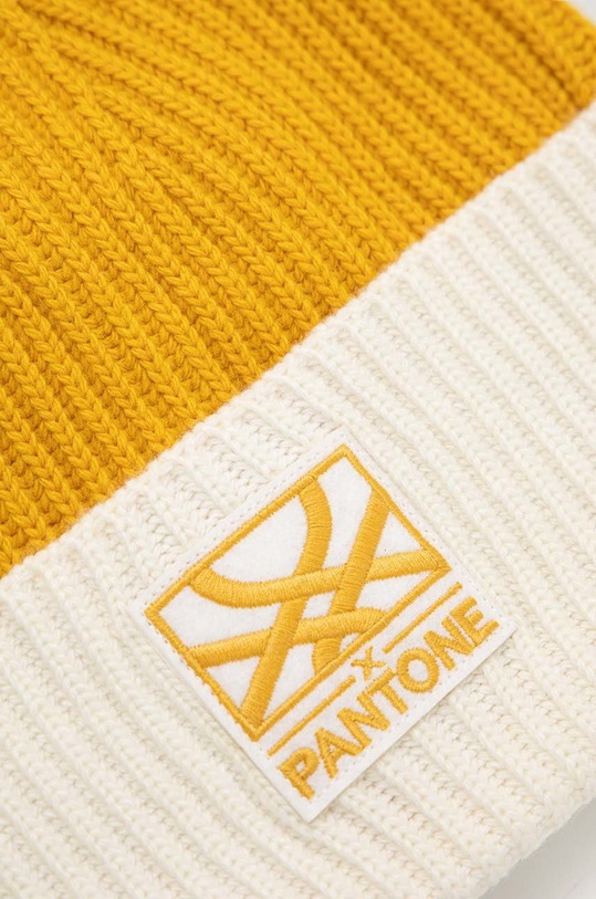 Akcesoria United Colors of Benetton czapka z domieszką wełny x Pantone 1435KA007.0D6 żółty