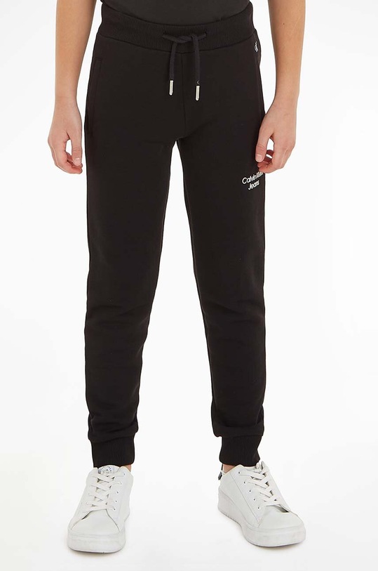 Detské tepláky Calvin Klein Jeans melanž čierna IB0IB01282.9BYY