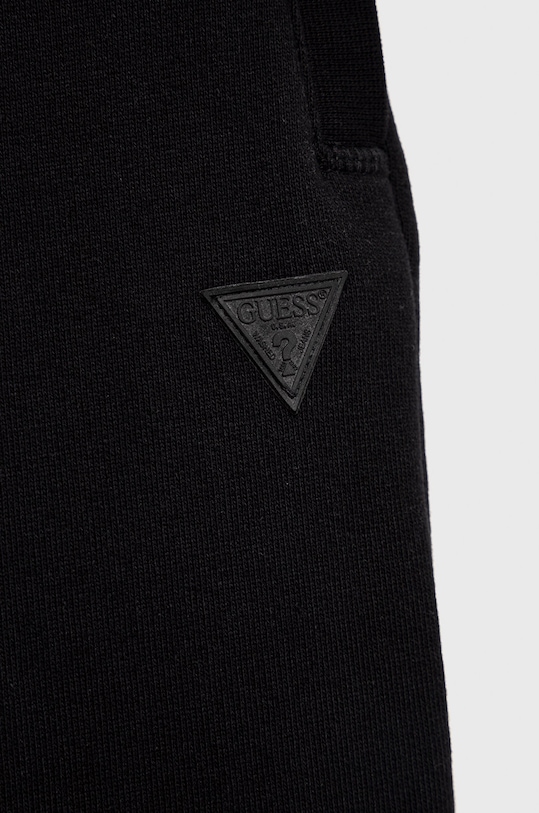 Detské tepláky Guess L2YQ46.KAIJ1 čierna AW22