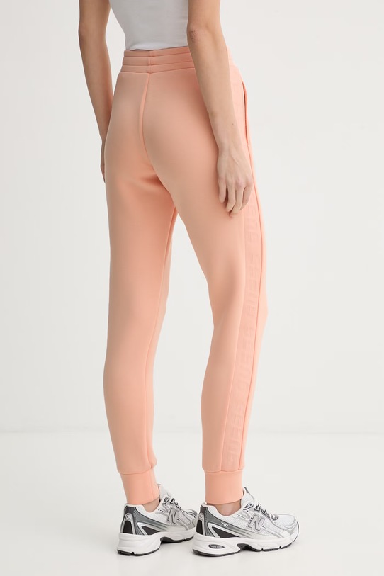 Odzież Guess spodnie dresowe ALLIE V2YB18.K7UW2 pomarańczowy