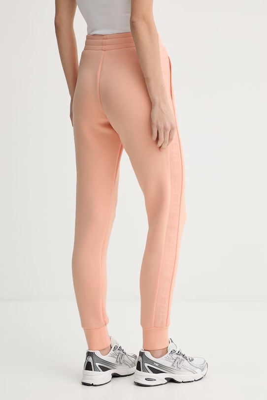 Odzież Guess spodnie dresowe ALLIE V2YB18.K7UW2 pomarańczowy