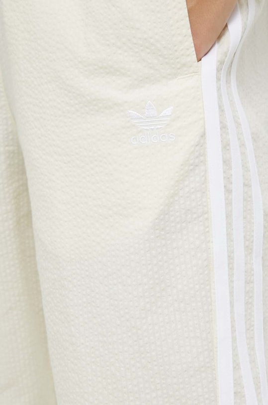 adidas Originals spodnie dresowe bawełniane beżowy HL9309