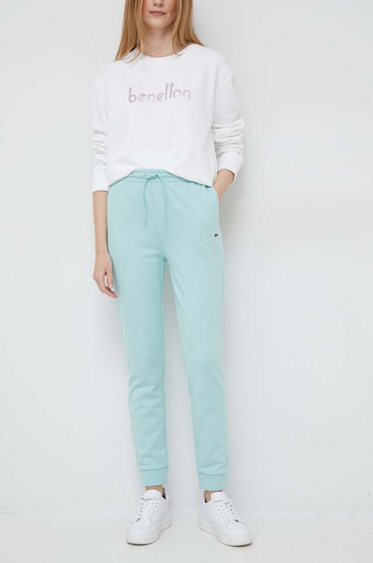 Lacoste spodnie dresowe dzianina turkusowy XF9216