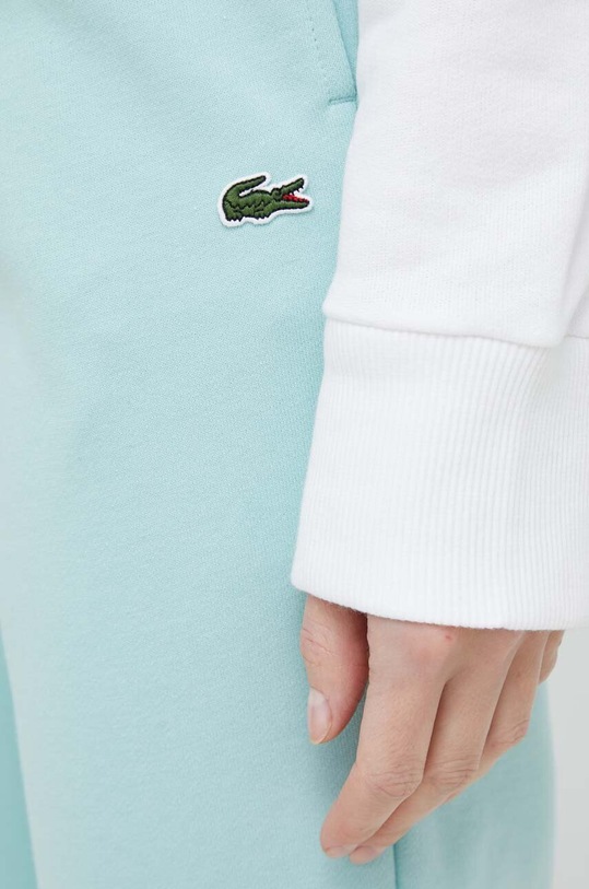 Lacoste spodnie dresowe turkusowy XF9216