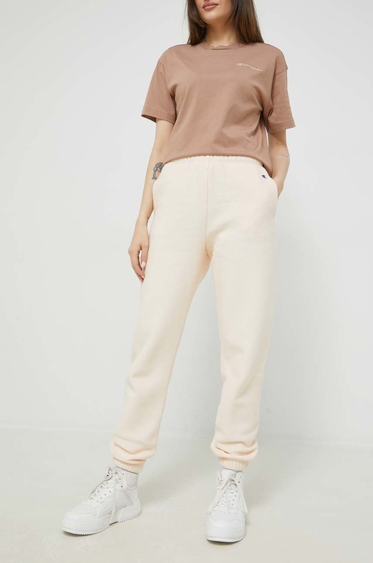 Champion spodnie dresowe dzianina beżowy 115722