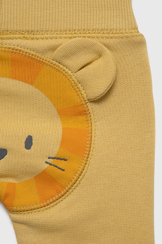 Chłopiec United Colors of Benetton spodnie dresowe bawełniane dziecięce 3J70AF009.W żółty