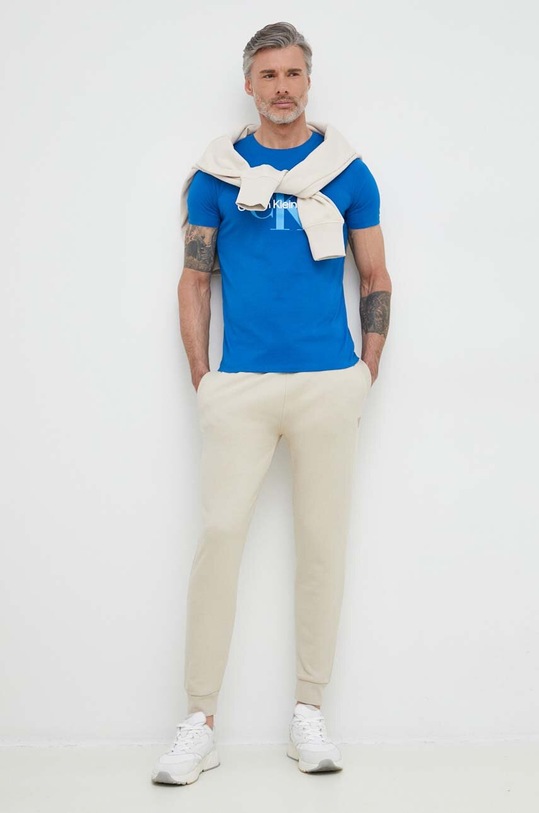 Tepláky Guess ALDWIN Z2YB22.KAIJ1 béžová SS25