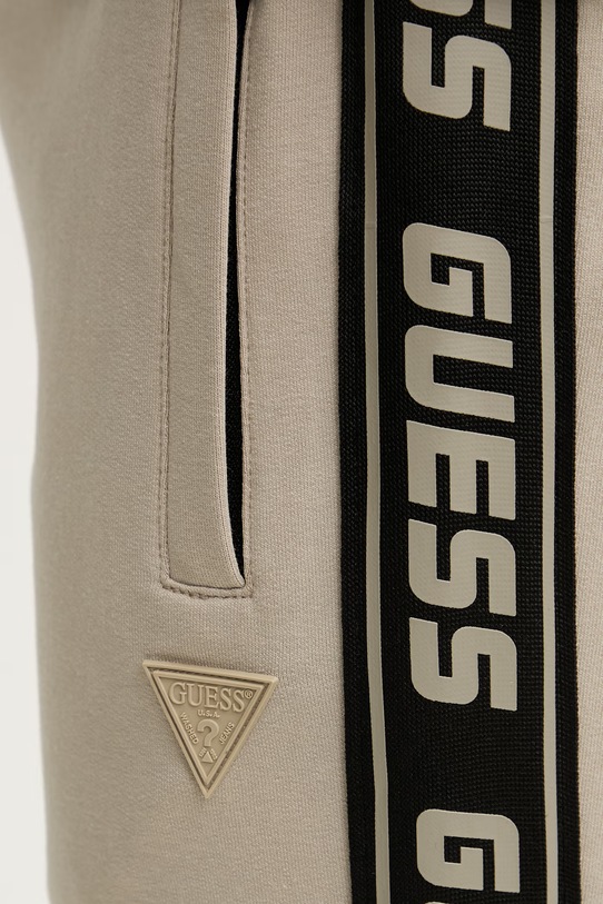 Guess spodnie dresowe beżowy Z2YB19.K6ZS1