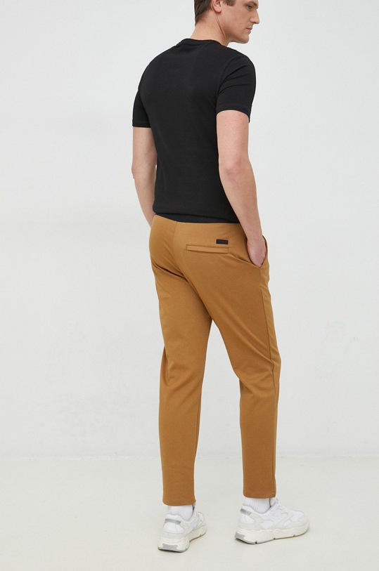 Odzież Calvin Klein spodnie K10K109913.9BYY brązowy