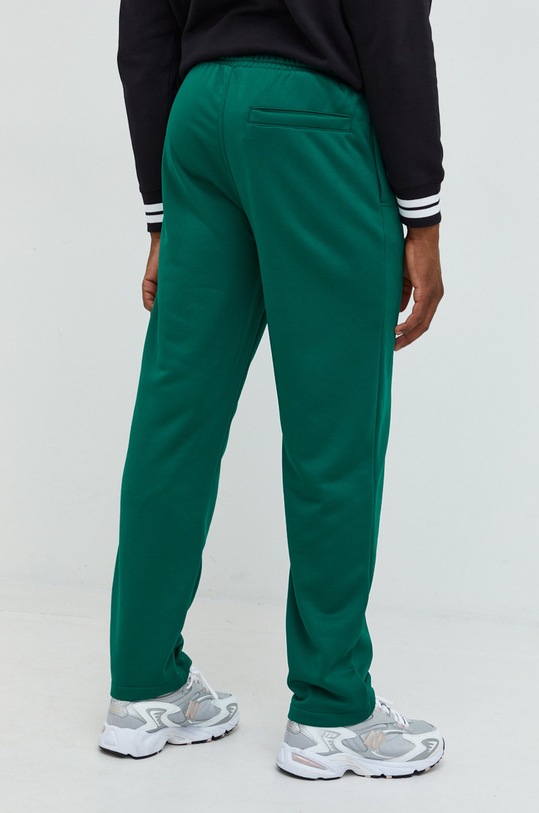 Odzież Tommy Jeans spodnie dresowe DM0DM15036.9BYY zielony