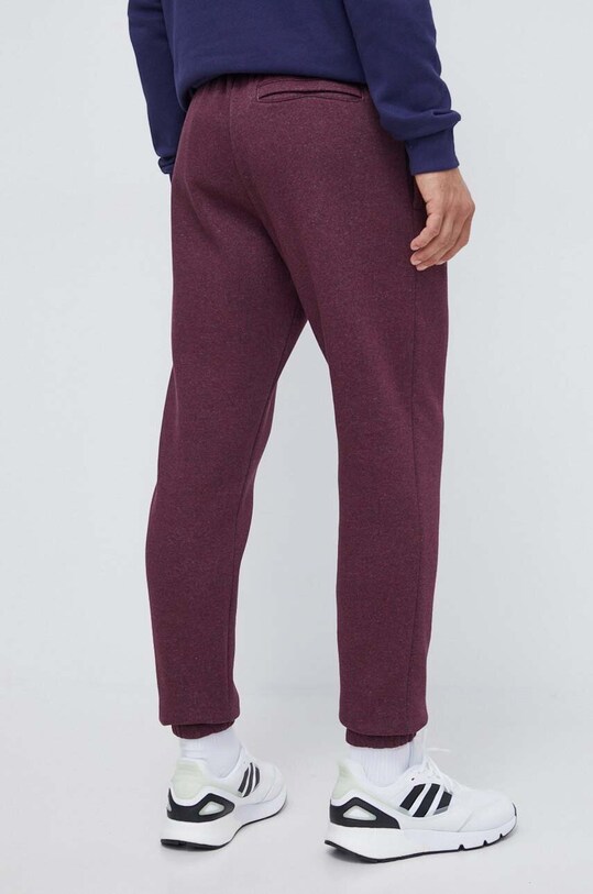 Odzież Under Armour spodnie dresowe 1373882 bordowy