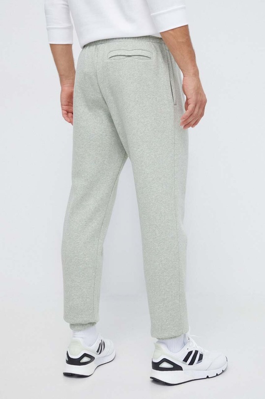 Odzież Under Armour spodnie dresowe 1373882 zielony