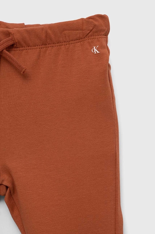 Deklice Otroška trenirka Calvin Klein Jeans IN0IN00017.9BYX oranžna