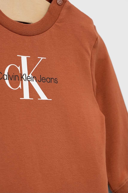 Otroška trenirka Calvin Klein Jeans oranžna IN0IN00017.9BYX