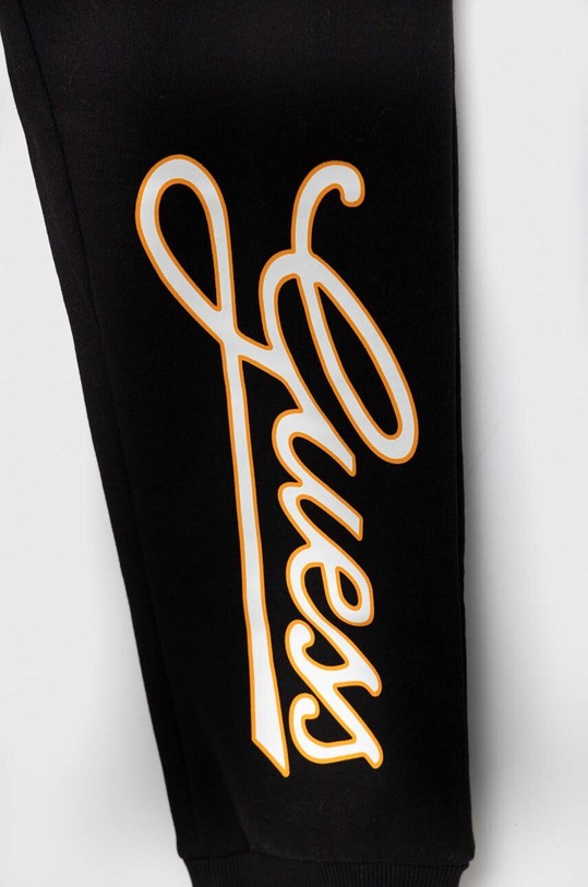 Otroška bombažna trenirka Guess črna L3YQ34.KA6R3.9BYX