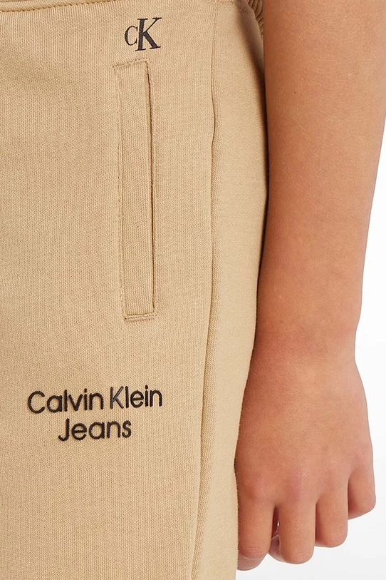 Dječji donji dio trenirke Calvin Klein Jeans IB0IB01282.9BYX bež