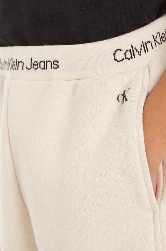 Calvin Klein Jeans spodnie dresowe dziecięce IB0IB01681.9BYX beżowy