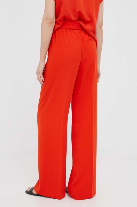 Odzież Calvin Klein spodnie K20K205857 pomarańczowy