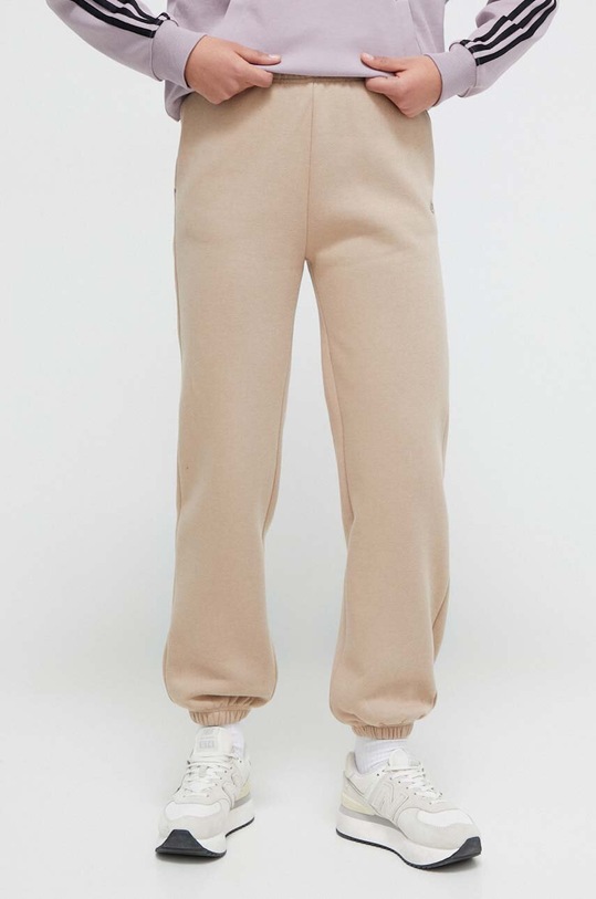 Champion spodnie dresowe dzianina beżowy 116686