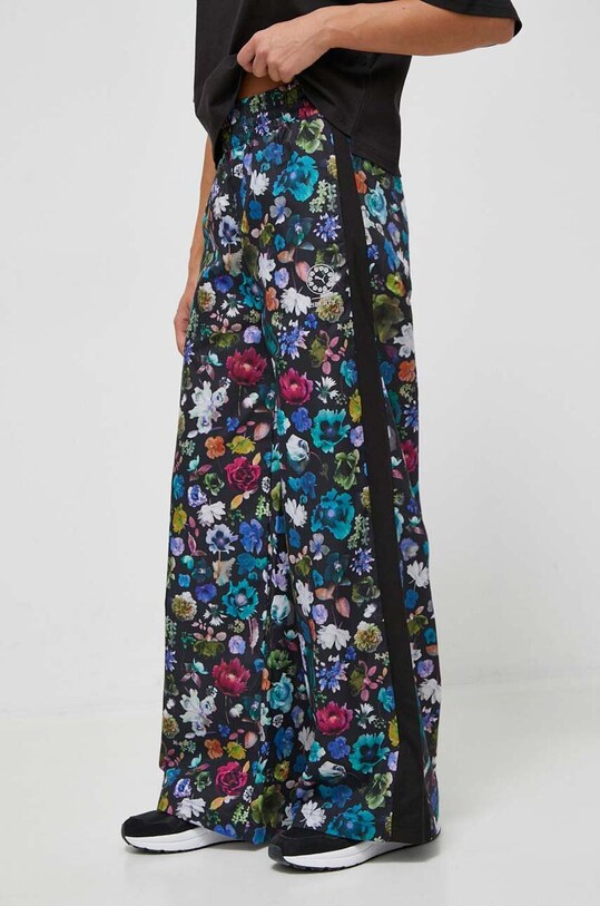 Odzież Puma spodnie dresowe x Liberty 622673 czarny