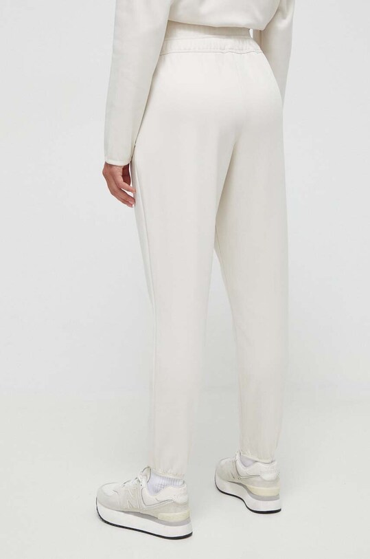 Îmbrăcăminte Puma pantaloni de trening 523877 bej