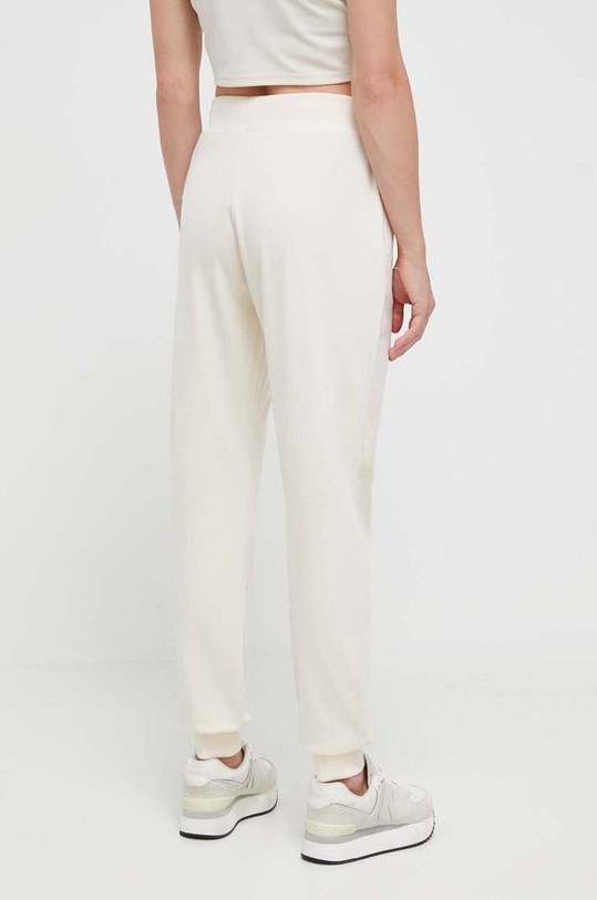 Odzież Guess spodnie dresowe COUTURE V3BB27.KBXI2 beżowy