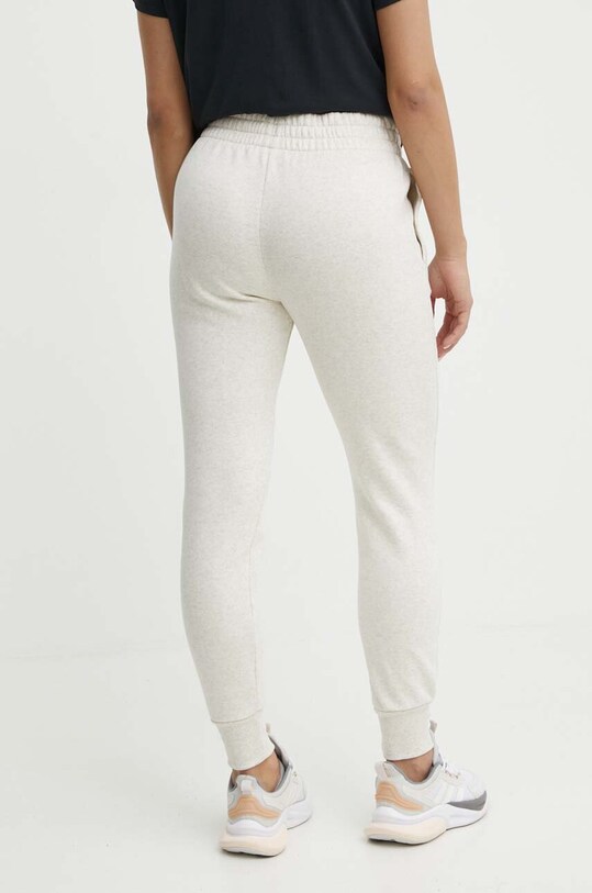 Odzież Under Armour spodnie dresowe 1379438 beżowy